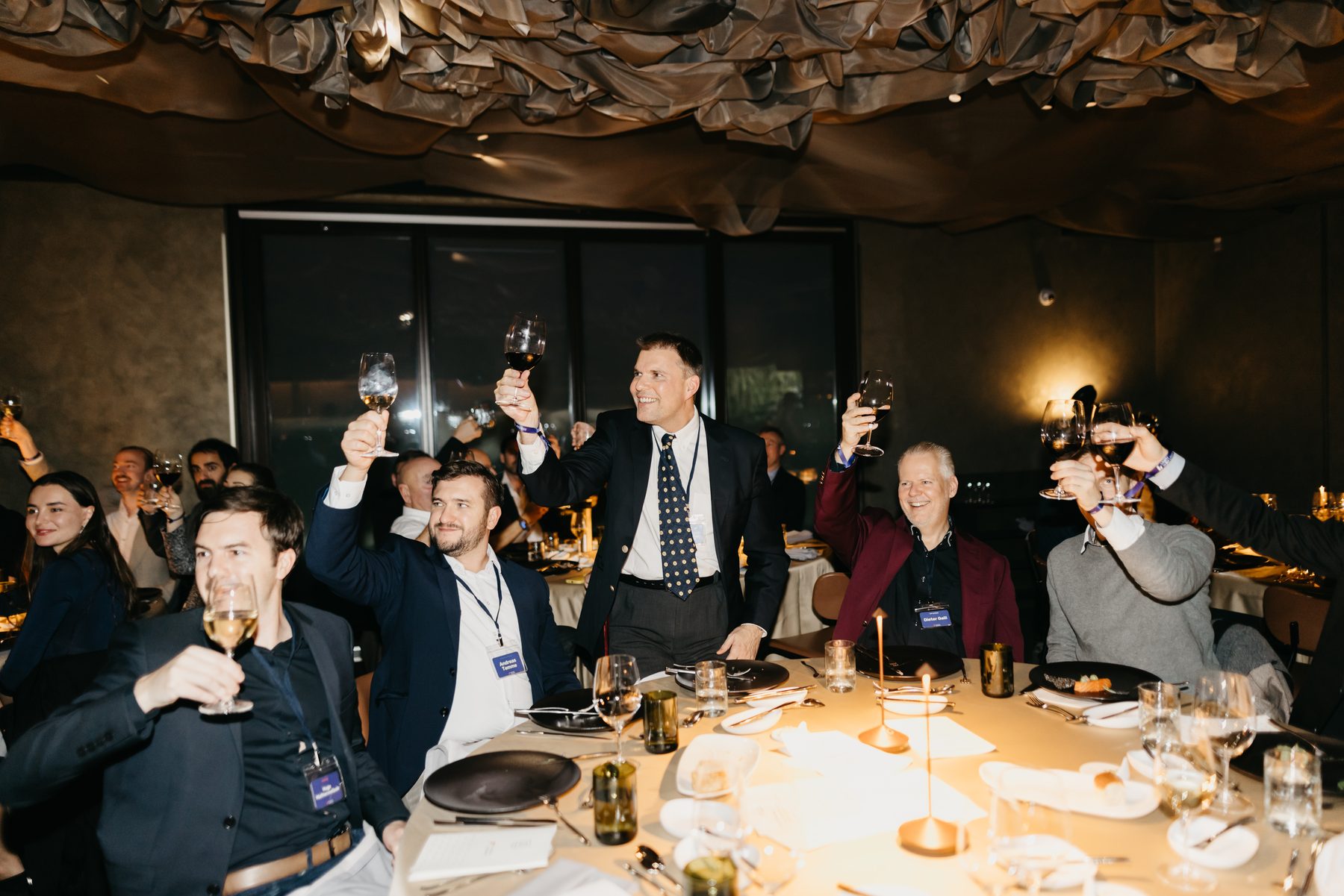 Guests raising a toast at a Free Cities Conference dinner